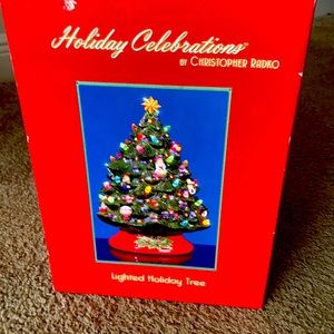 A Christmas tree lights up.